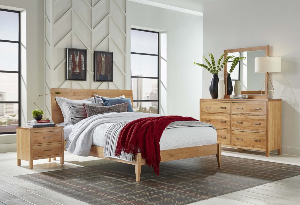Archbold West solid wood bedroom furniture featuring a warm brown bed, dresser, mirror, and matching nightstand.