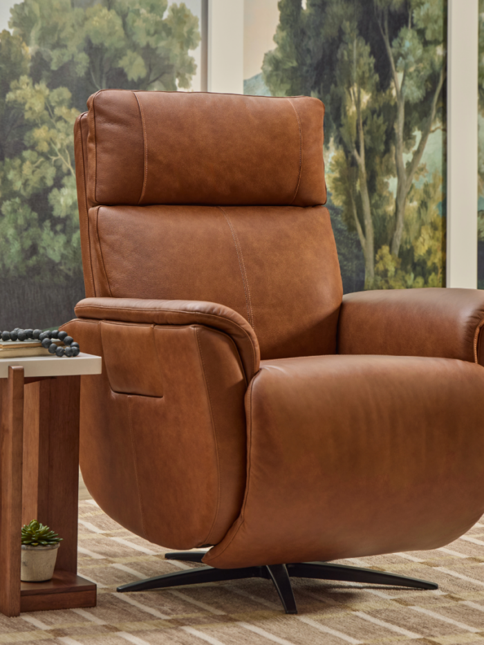 Flexsteel Cove leather power swivel recliner in warm brown leather with Meyers Furniture and Flooring logo