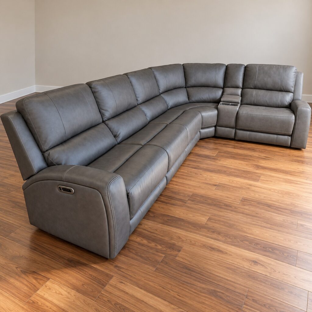 Belmont gray corner sectional with rounded padded arms and a console beside the right end seat