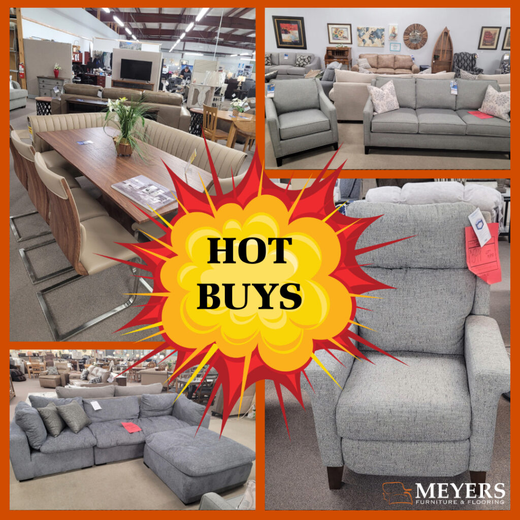 Hot Buys furniture deals featuring a rustic wood chest, gray loveseat, brown leather recliner, and a gray sofa with patterned pillows at Meyers Furniture showroom.