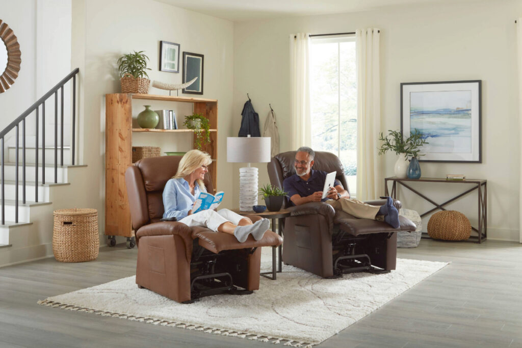 Couple relaxing in UltraComfort Polaris Power Lift Recliners in a bright living room