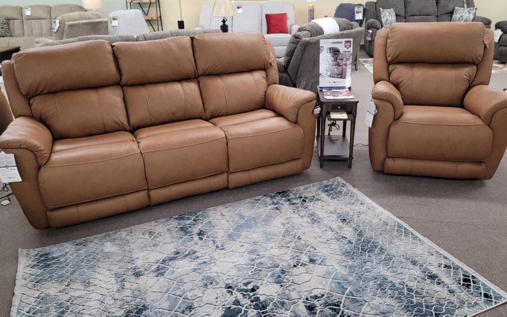HomeStretch leather sofa and matching recliner displayed on the showroom floor at Meyers Furniture & Flooring in Mendota, Illinois
