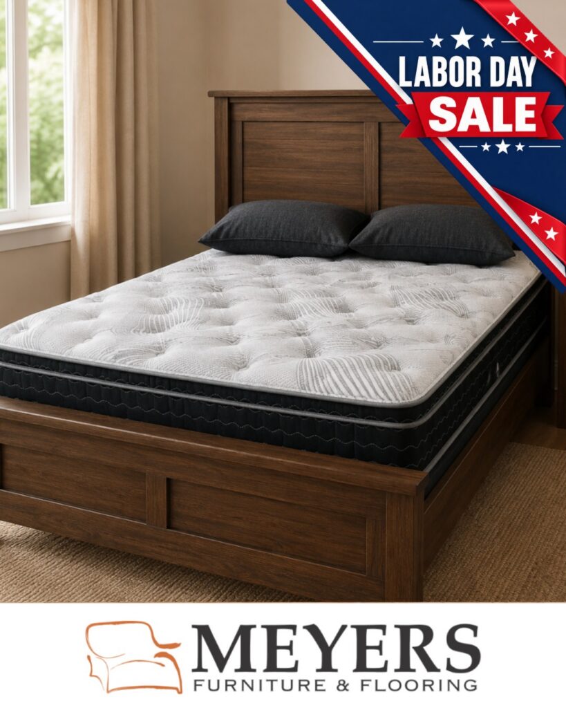 Mattress on a solid wood bed frame in a warm bedroom setting