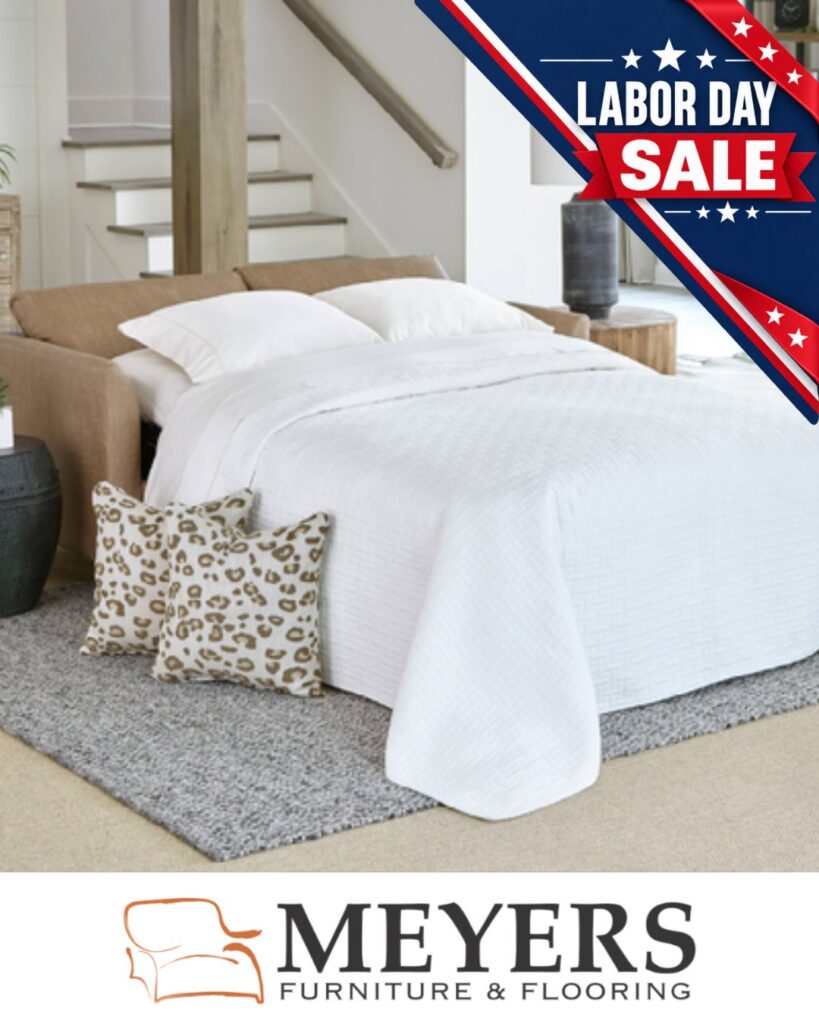 Upholstered sleeper sofa opened into a bed