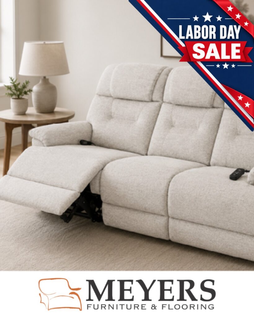 Light upholstered power reclining sofa with footrest extended