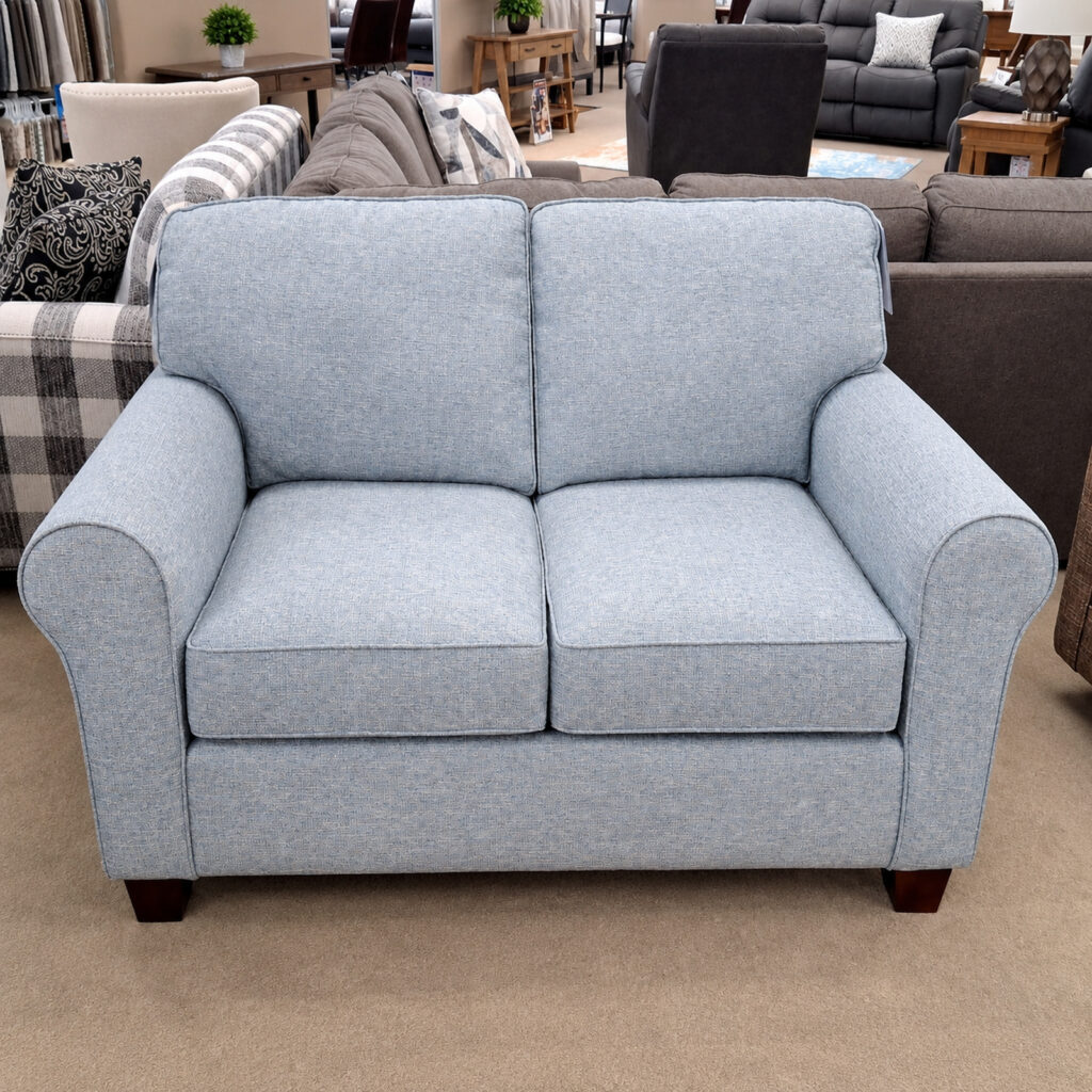 Blue-gray Best Home Furnishings loveseat with two seat cushions and rounded arms.